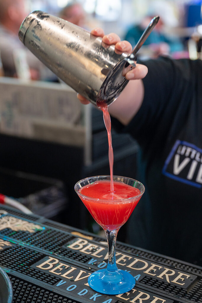 bartender pouring a fun cocktail at Little Village Pub in White Bear Lake, MN